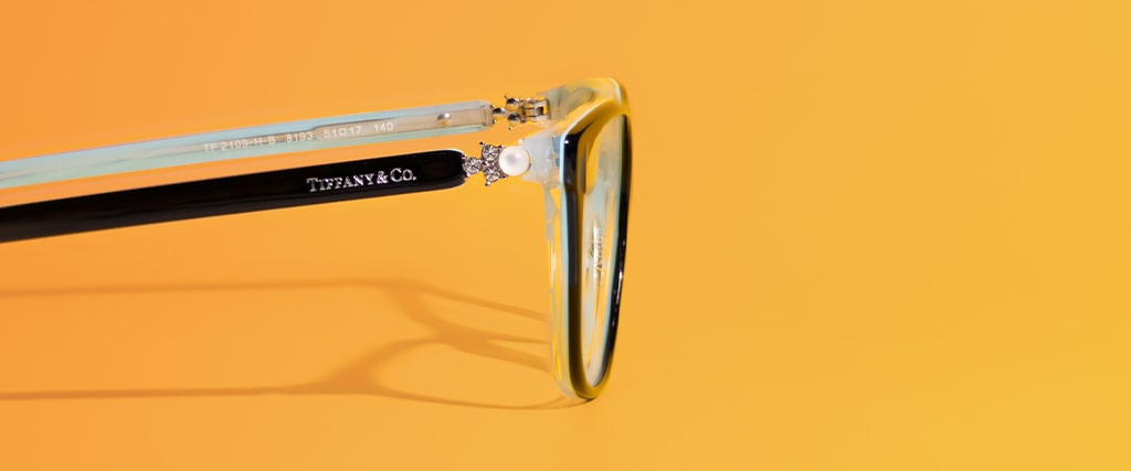 Blue rectangular Tiffany and Co. frames close-up with arms open facing to the right