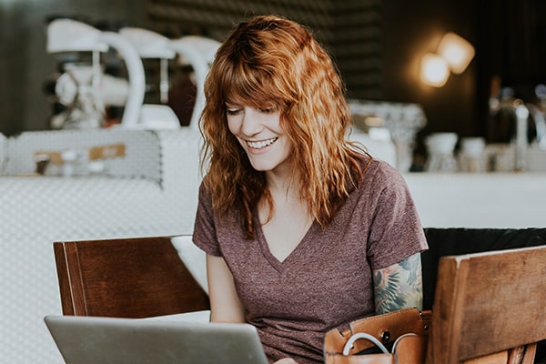 Happy female on their laptop