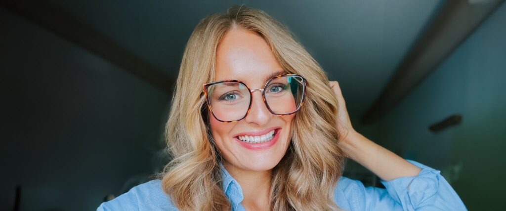 Woman wearing a pair of butterfly shaped frames