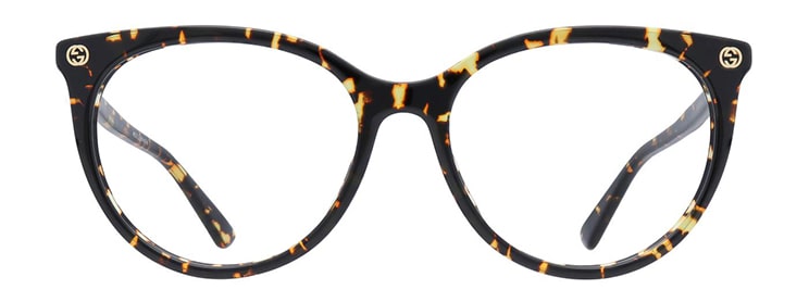 Havana Gucci oval glasses with gold-tone branding on the corners and a low-bridge fit.