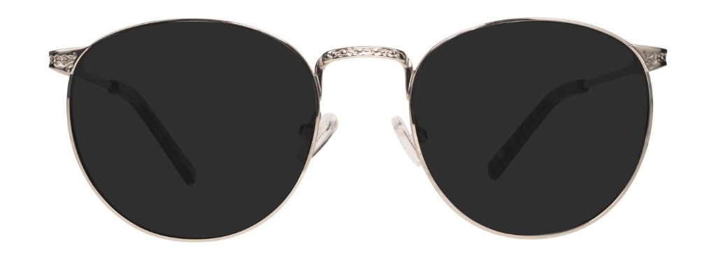 Round sunglasses with a silver metal frame featuring engraved detailing on the bridge and temples.