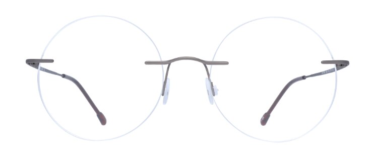 Rimless round metal glasses with  titanium temples and bridge. It features adjustable rubber nose pads. 