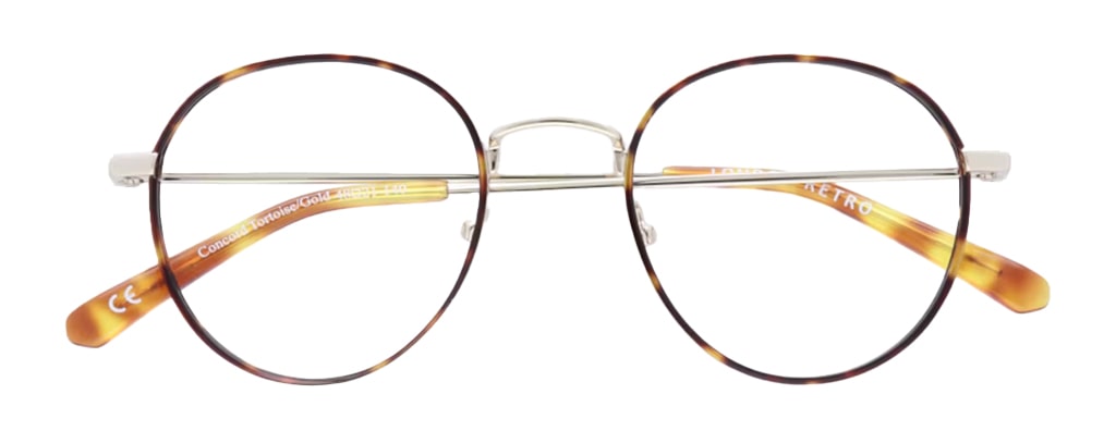 A round metal frame in gold with tortoiseshell print around the lenses and along the temple tips. It has a classic retro shape and rubber nose pads. The frame is in a folded-up position. 