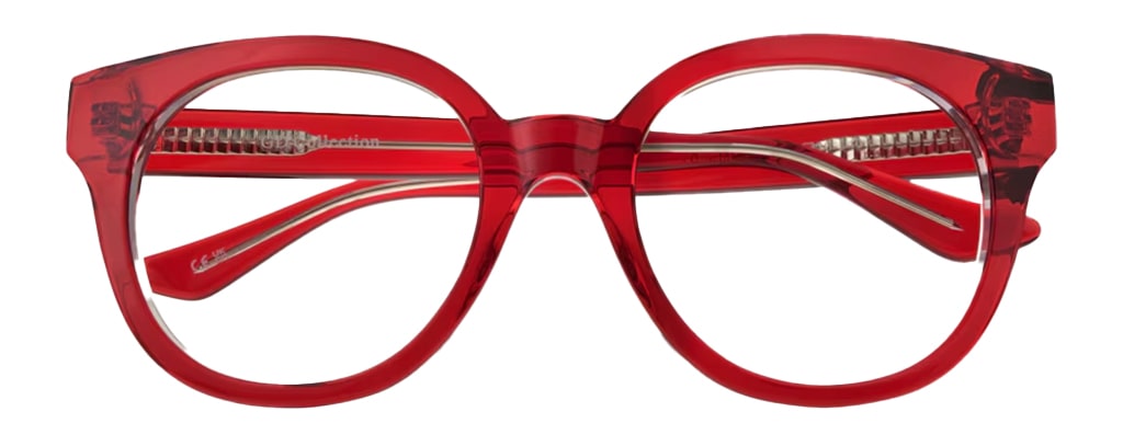 An extra-large bright transparent-red acetate frame with a cat-eye silhouette. The frame is in a folded-up position. 