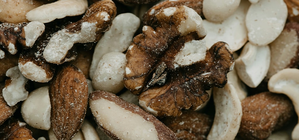 A close-up of cashews, walnuts and peanuts. 