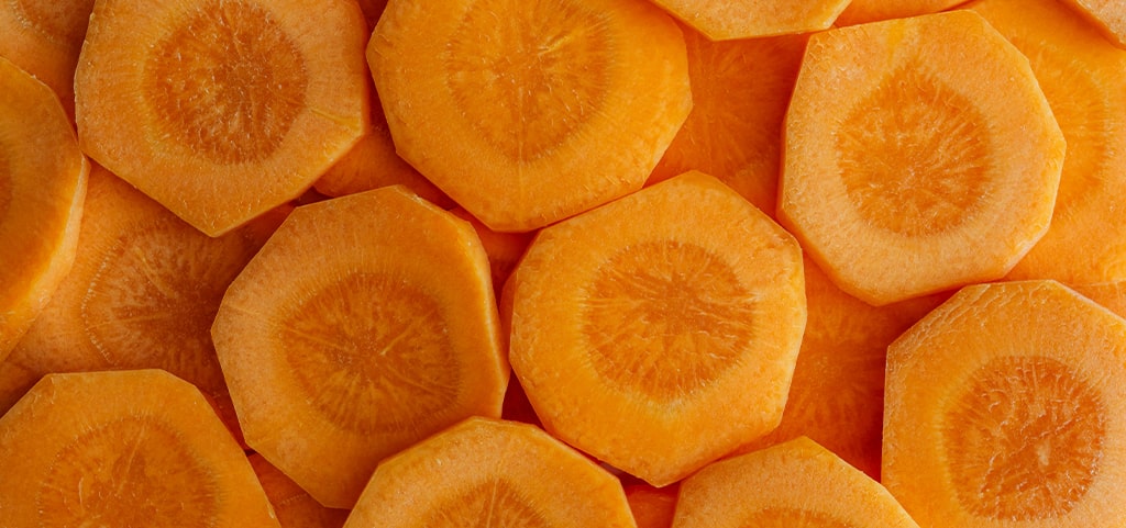 A close-up of several carrot slices. 