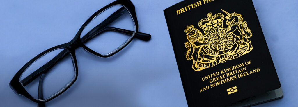 Can you wear glasses in a passport photo in the UK? 