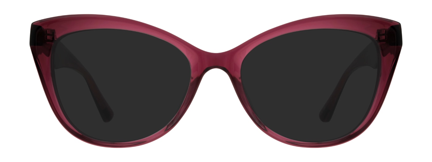 Small cat-eye sunglasses, made of raspberry pink acetate. The temples are bevelled. 