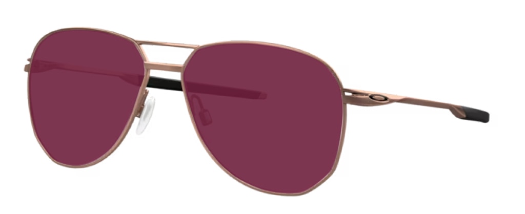 A pair of rose gold-toned aviator metal Oakley sunglasses angled to one side, featuring ruby-coloured lenses, a double bridge and the Oakley 'O' logo embossed on the arms.