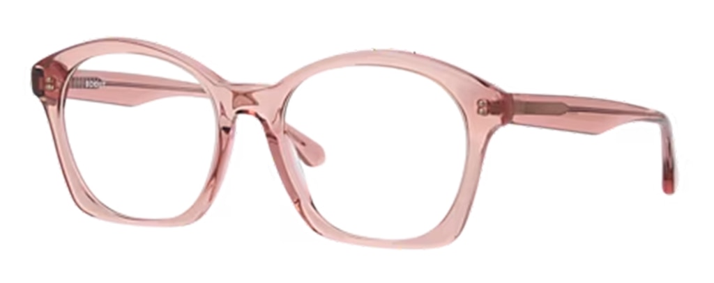 A pair of large squared cat-eye frames in light pink bio-acetate, positioned to one side. 