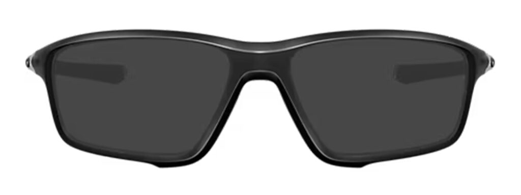 A pair of matte black wraparound square Oakley sports sunglasses with transparent hinges and Oakley branding. 