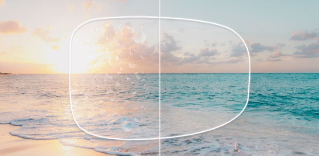 A beach scene split down the middle to demonstrate lens performance. The left side shows a warm sunset over the ocean with water droplets on the surface, suggesting reduced visibility, while the right side shows a clearer, brighter turquoise sea under a blue sky. A rounded rectangular outline in the centre resembles a lens, emphasising the effectiveness of a hydrophobic coating.