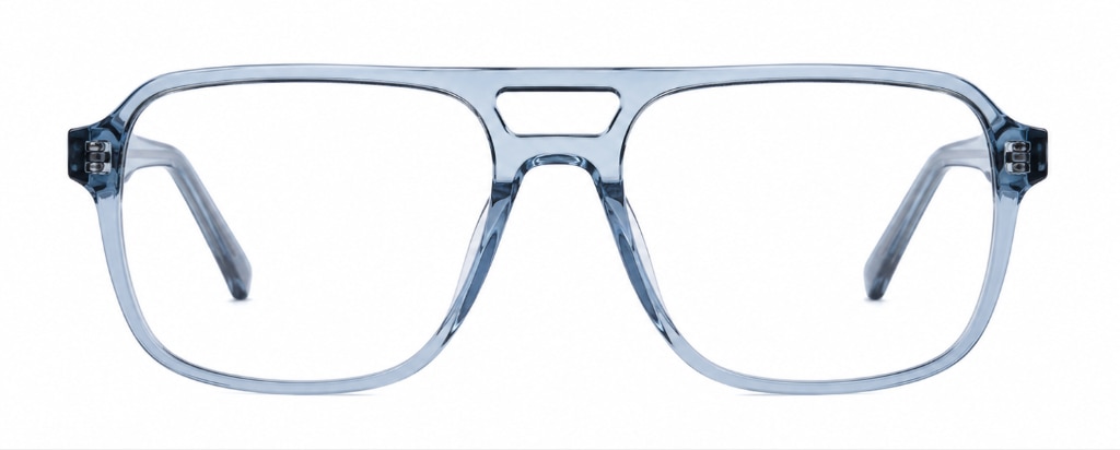 Front-facing view of Scout Michael oversized aviator-style eyeglasses with a translucent crystal-blue acetate frame. The frame features large squared lenses, a bold double bridge and a contemporary geometric silhouette. Visible temple arms behind the lenses emphasise the frame's lightweight construction and stylish design.