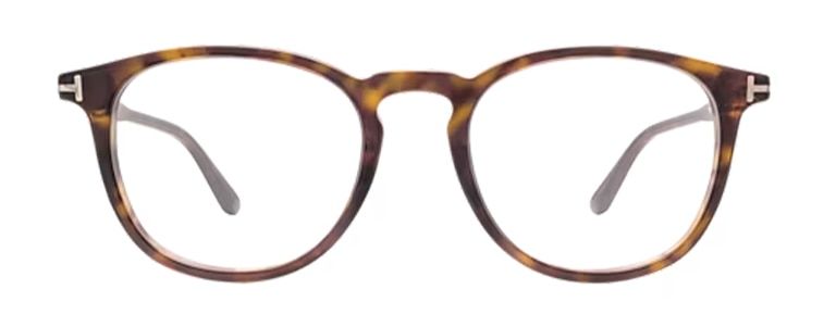 Tom Ford FT5401 round glasses with a tortoiseshell frame, keyhole bridge and classic gold metal T-shaped detailing along the temples.