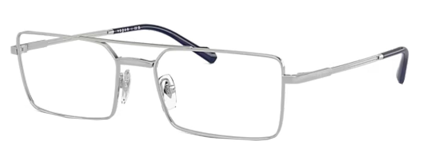 A pair of large silver rectangular Vogue glasses, made of metal with a double-bridge design. The nose pads are transparent and the brand logo is just visible along the temples.