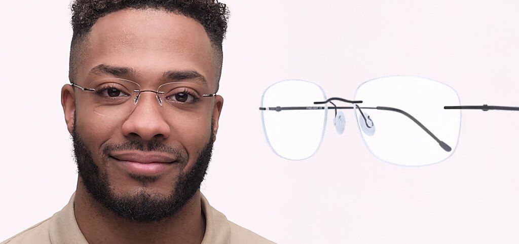 A close-up of a young man with short, black curly hair that is cropped at the sides. He has brown eyes and a  beard. He is wearing a pair of rimless, rectangular black metal glasses and a beige shirt. The same glasses are displayed closer up at an angle n
