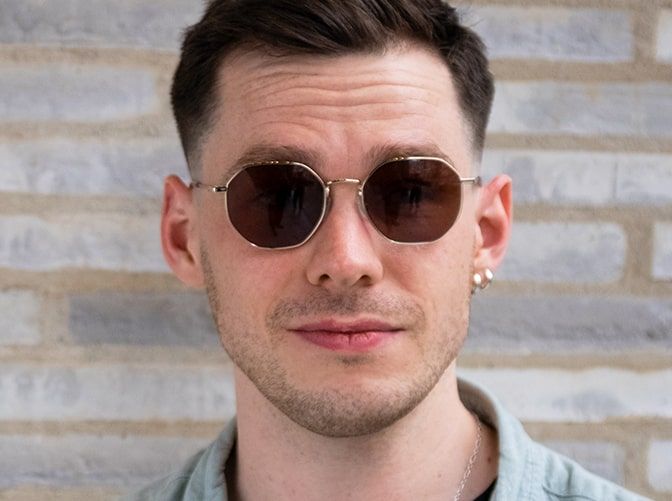 Man wearing Tommy Jeans TJ0096 glasses