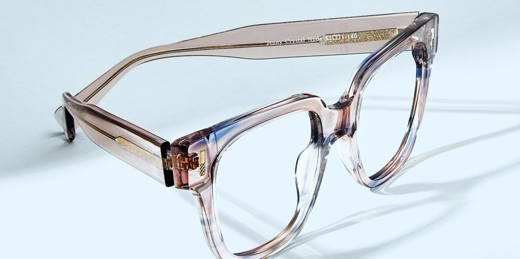 Square, chunky, crystal nude Scout frame facing the right corner on a pale blue background