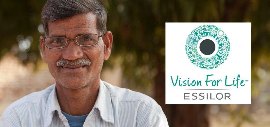 Older male with a moustache wearing a pair of glasses with the Vision for Life Essilor logo