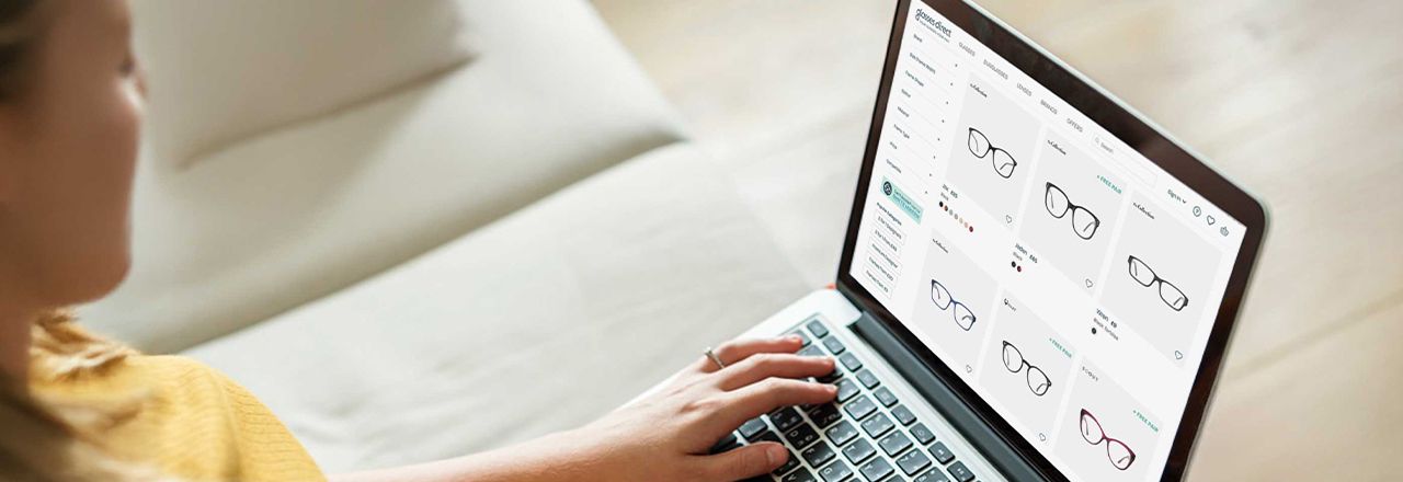 A woman browsing the Glasses Direct website for her first pair of glasses