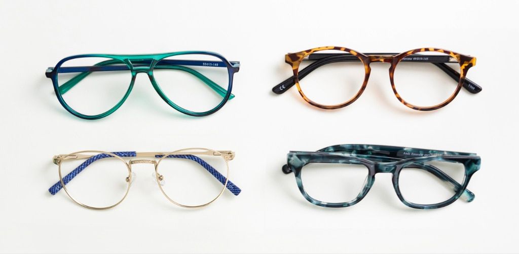 Four pairs of glasses displayed against a light background, including a green pilot frame, a Havana round frame, a gold metal round frame, and a multi-coloured green rectangular frame made from different materials and styles.