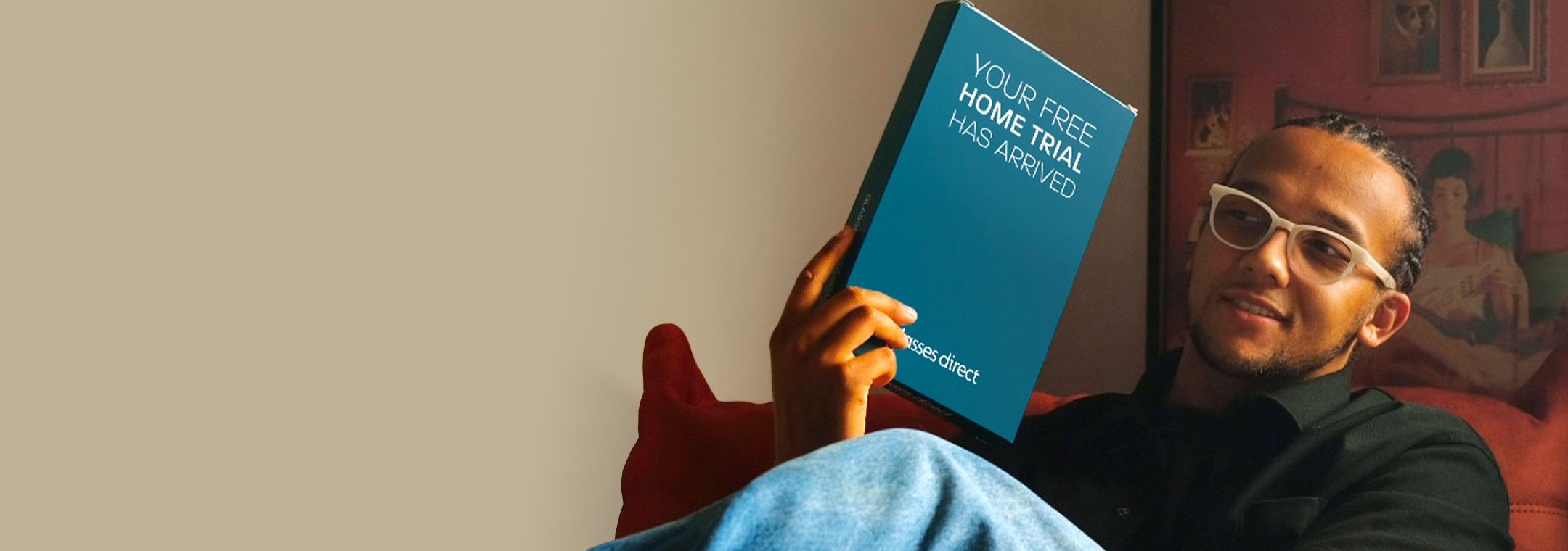 Perri Kiely holding a Glasses Direct Home Trial box