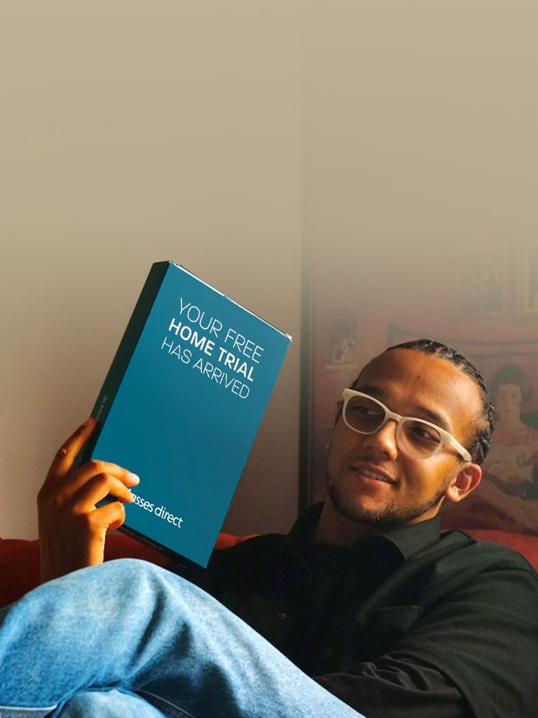 Perri Kiely holding a Glasses Direct Home Trial box