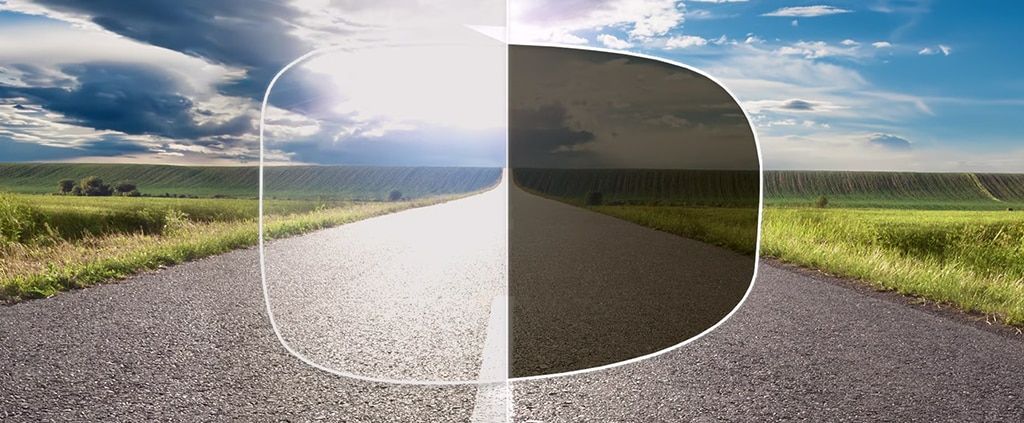 A graphic illustrating the difference between a polarised lens and a clear lens, showing an open country road view.