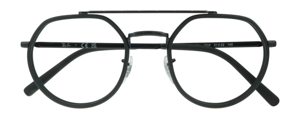 A black metal frame with a geometric top and rounded bottom. It has a thin top bar and features engraving along the nose bridge and temples. Acetate lines the lenses and temple tips. The frame is in a folded position.