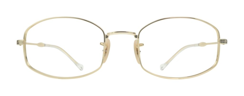 This small gold pillow-shaped frame by Ray-Ban is made of gold metal and has rubber nose pads.