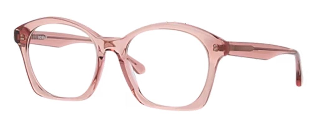 A pair of large squared cat-eye frames in light pink bio-acetate, positioned to one side.