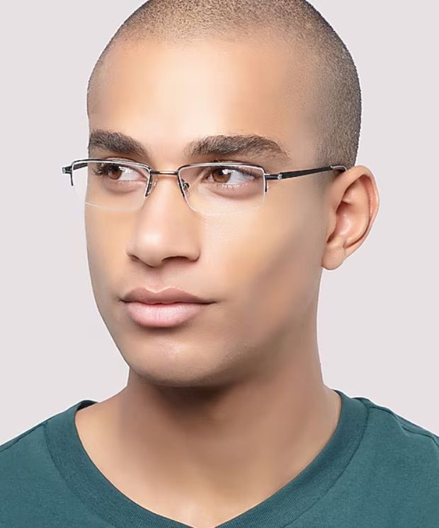 Slim rectangular gunmetal glasses with a low-bridge fit, modelled by a man with a shaved head, offering a secure and comfortable fit.