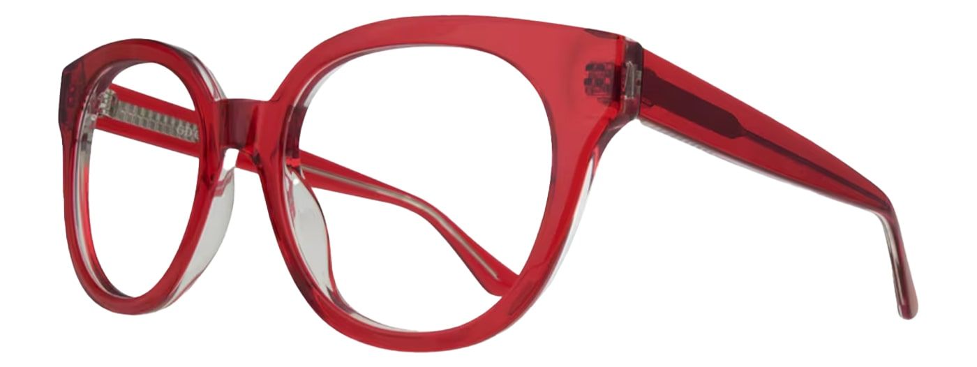 A bright red acetate frame with a clear under layer. It has an extra-large cat-eye shape and is propped open to one side.