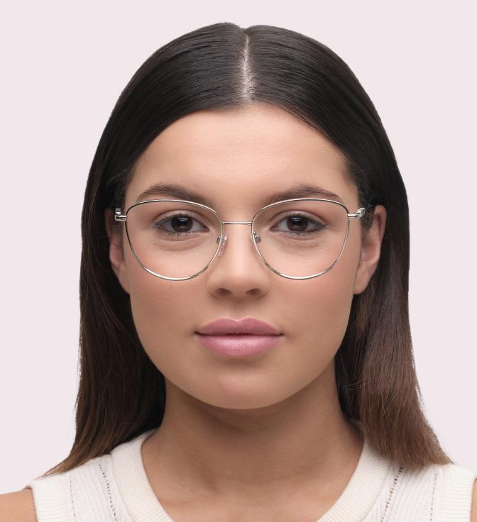 A woman with long straight hair wearing Burberry BE1376 glasses