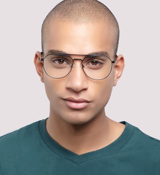 A man with a buzz cut wearing Glasses Direct Colby glasses