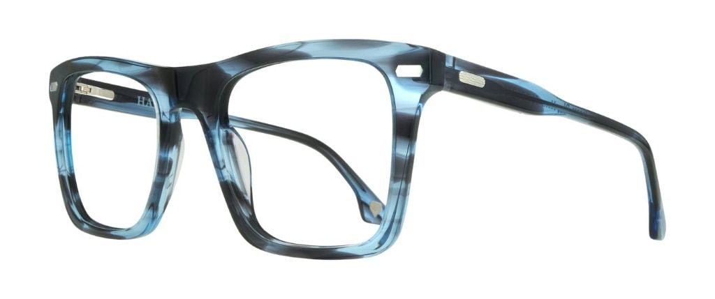 An oversized rectangular frame made of acetate with a dreamy blue horn aesthetic, featuring pin detailing at the edge of the lenses and along the temples.