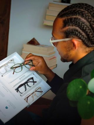 Perri Kiely looking at four frames in a Home Trial box