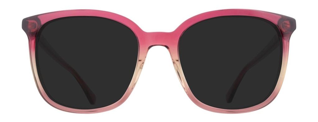 A large pair of butterfly sunglasses made of acetate that's pink at the top and fades towards nude at the bottom
