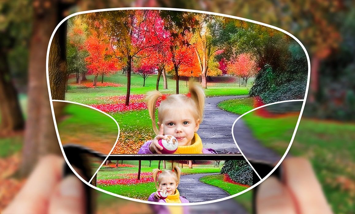 View of a child having their picture taken in the park through a varifocal lens