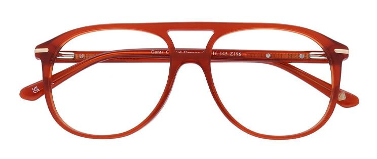 Pilot-style amber-coloured acetate glasses with metal accents along the temples, folded.