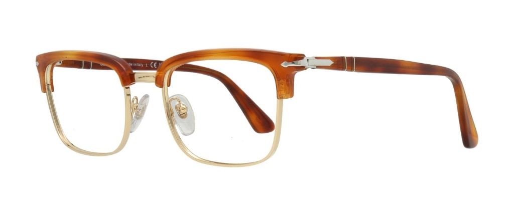 A rectangular frame in an earthy yellowish brown made of acetate with metal rims and metal nose bridge. The hinges and corner of the frame feature Persol's signature metal arrow design.
