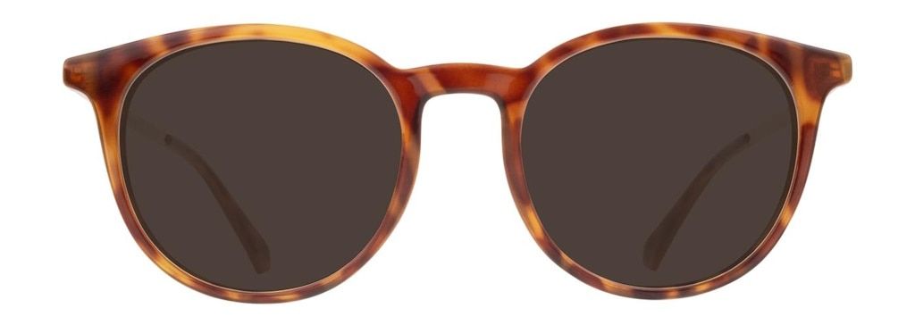 A round pair of acetate sunglasses whose frame features a tortoiseshell pattern