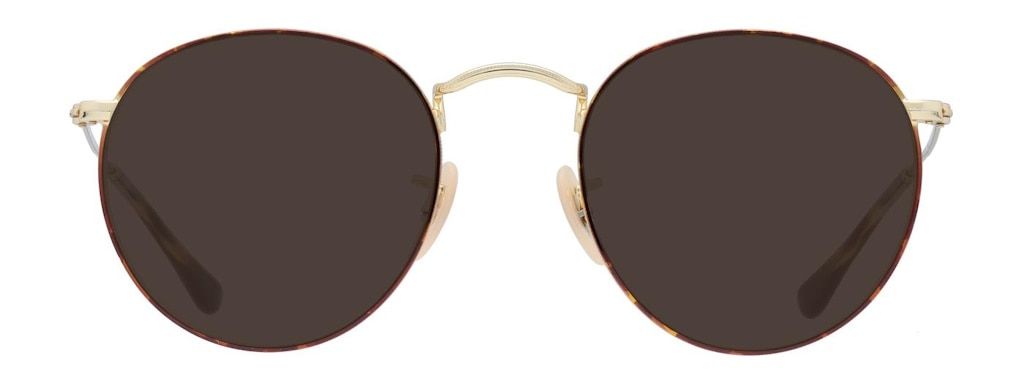 A pair of sunglasses with round lenses and a thin metal frame. The lenses are surrounded by fine tortoiseshell acetate.