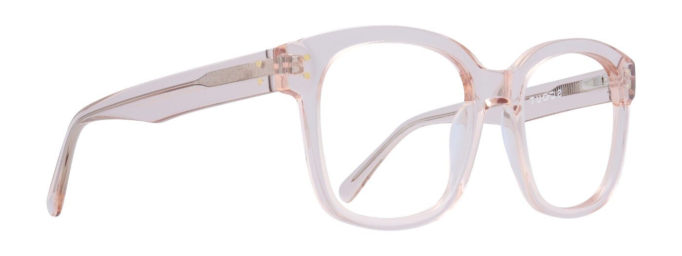 A large pair of transparent acetate glasses, turned to one side. The wire core of the frame is visible along the temples.